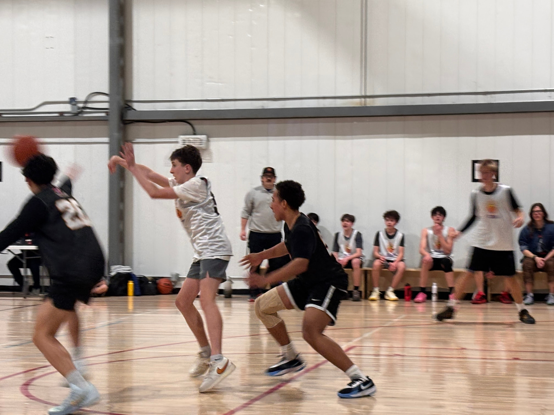 Young athlete wearing a custom SD Medical knee brace during basketball